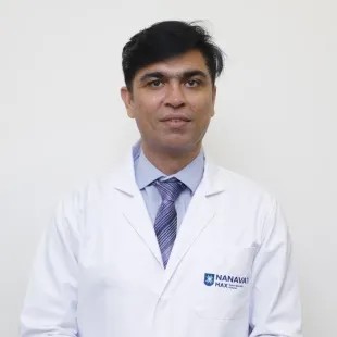 Dr. Anil Singh, liver transplant intensivist and critical care specialist in Mumbai, in white coat